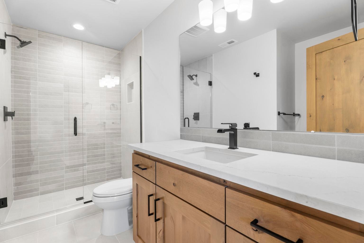 Both upstairs bathrooms have the vanity, bathtub and shower
