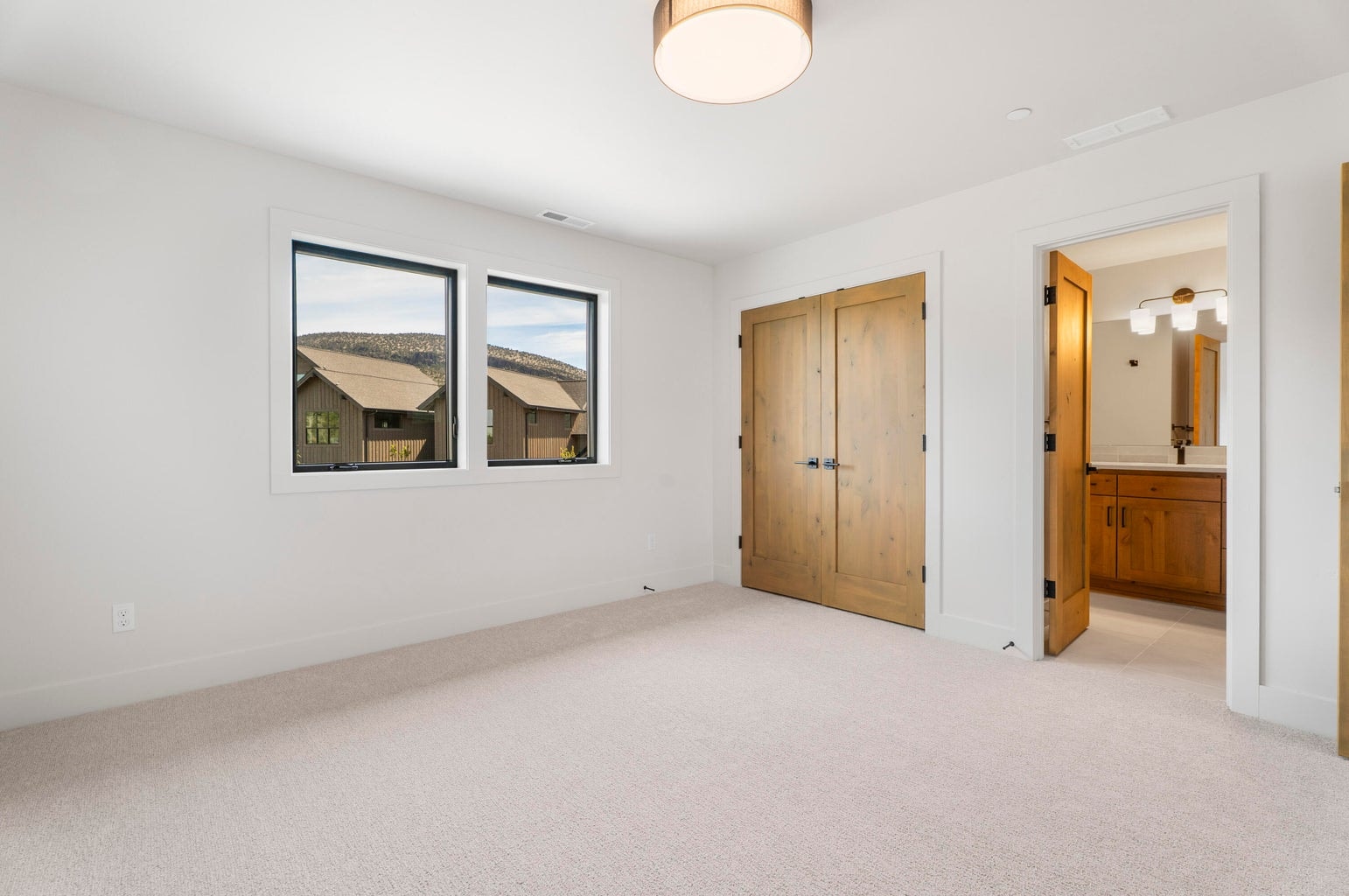 One of the upstairs guest bedrooms has direct bathroom access