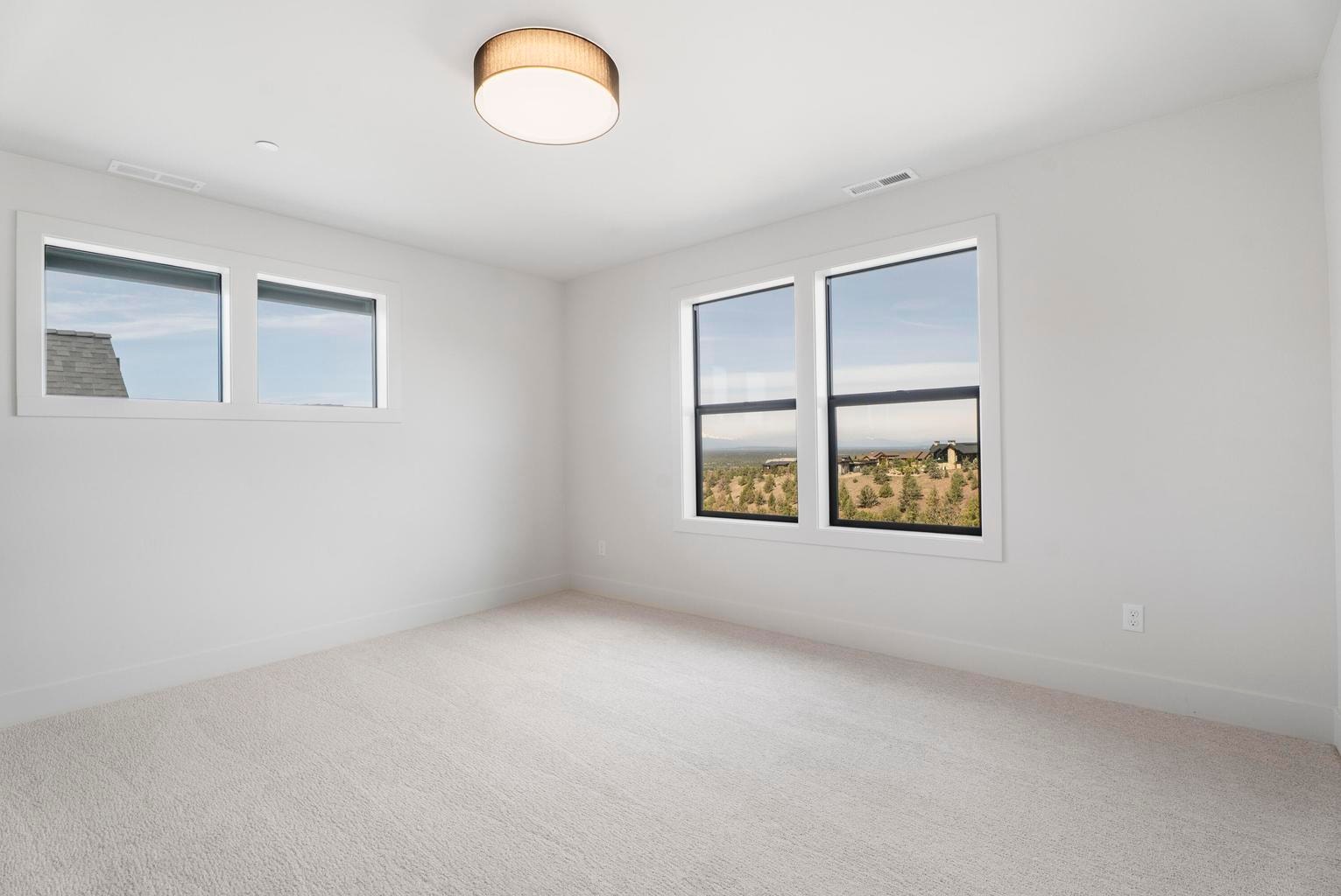 The fourth bedroom of the home has arguably some of the best views to the northwest from the top floor