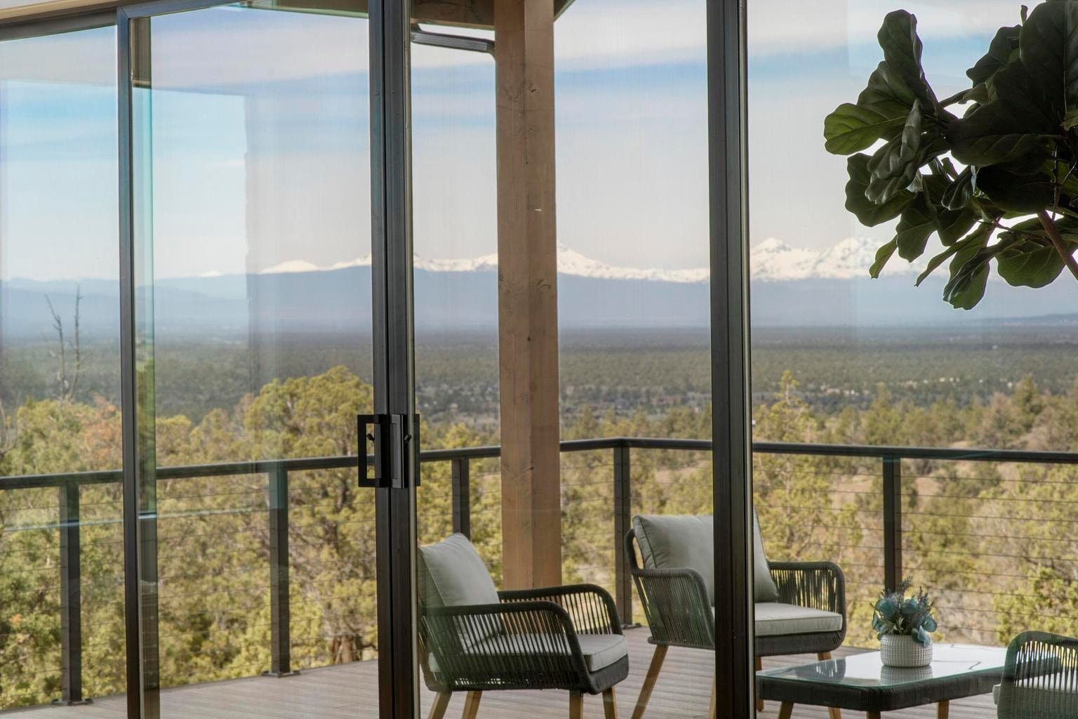Great room opens to covered back deck with lots of space and views of a protected community area out to the Cascade Mountains