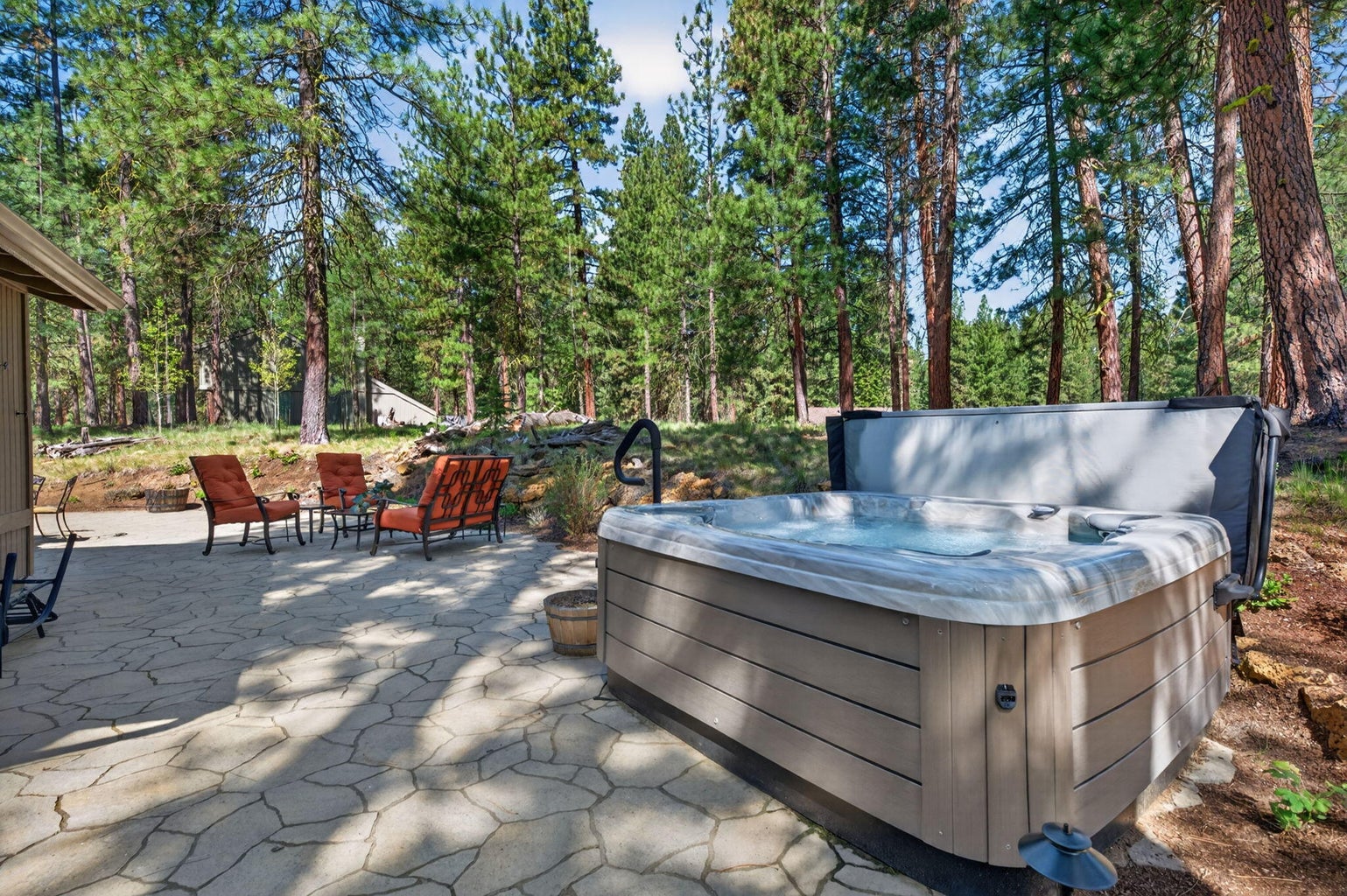 Hot Tub and Wrap-Around Natural Stone Patio
