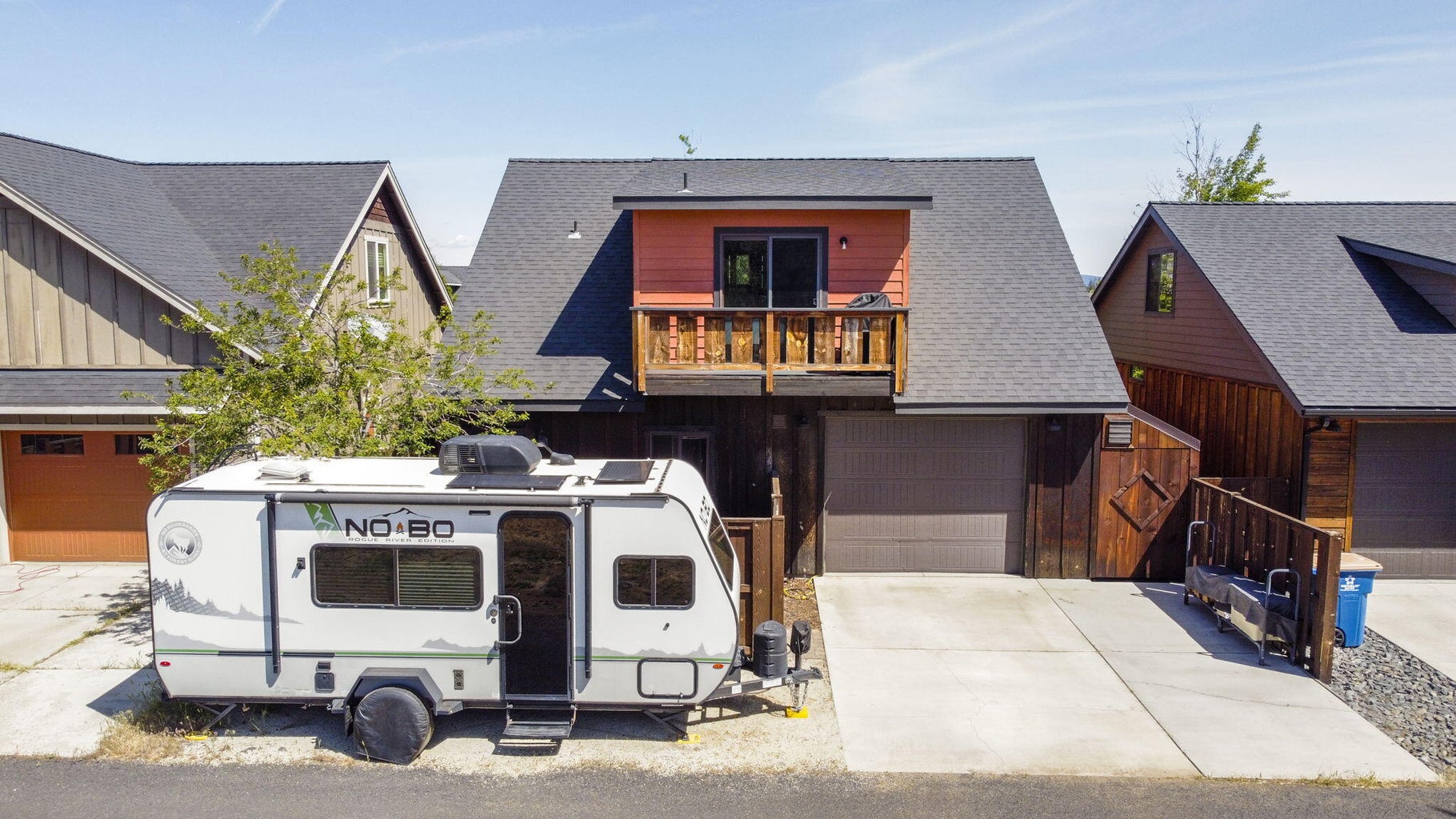 An added covered storage area connected through the garage provides a convenient space for storing skis, bikes, and all your gear