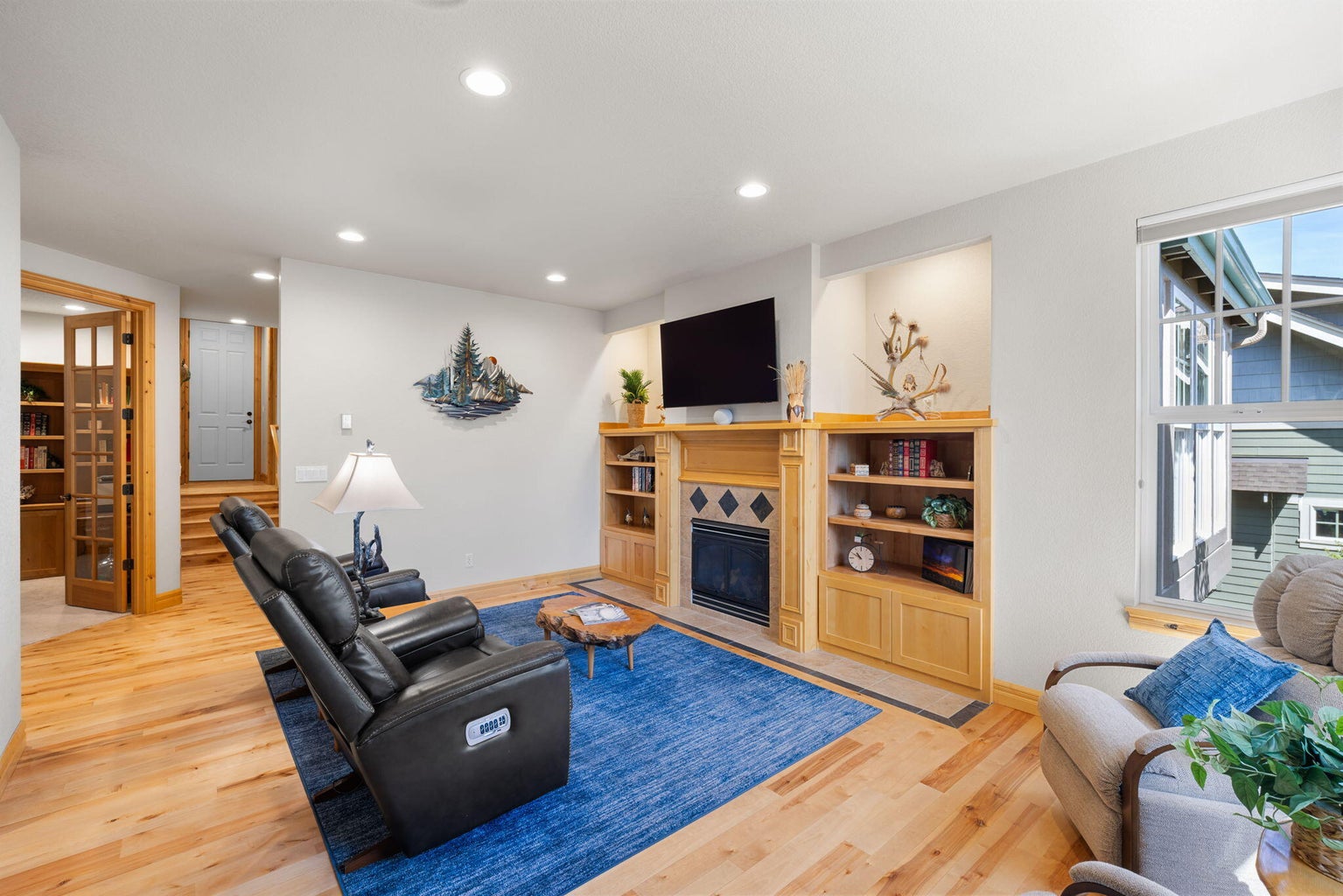 Living Room has built-ins and smart lighting