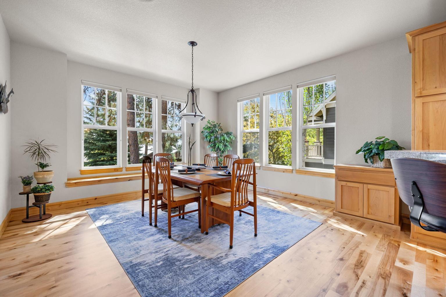 Large dining room with front window seat
