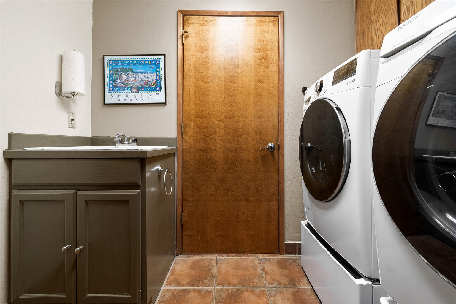 Laundry off garage has a utility sink