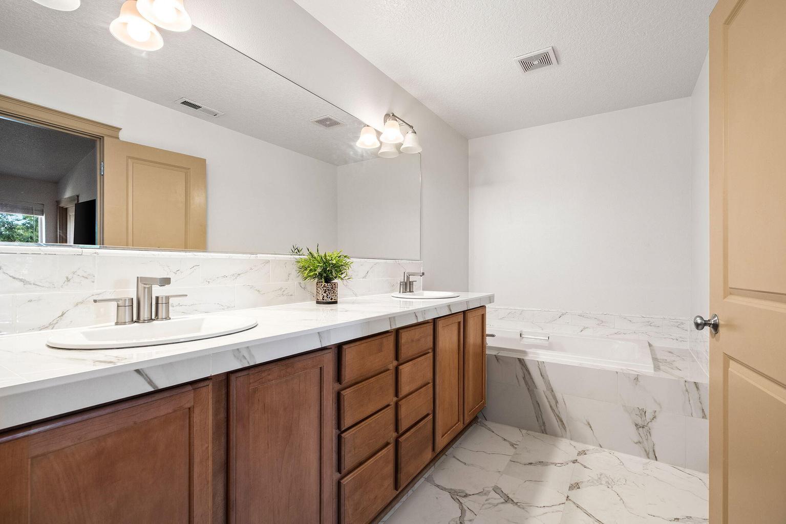 completely updated primary bath, dual sinks & soaking tub