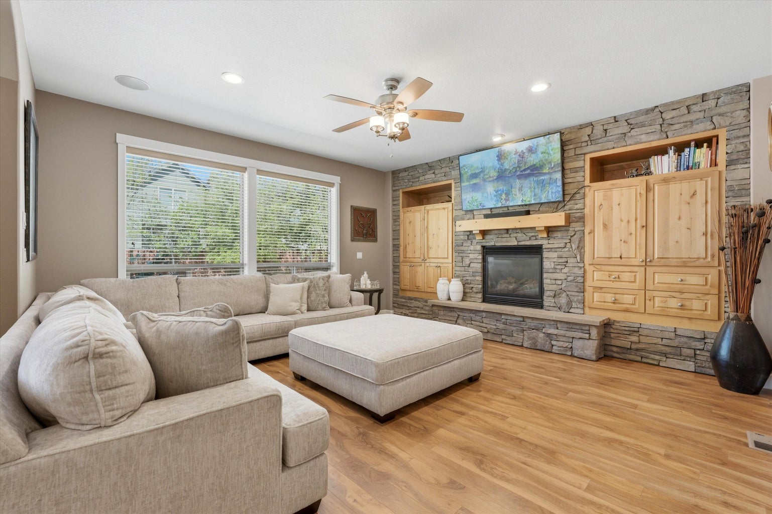 Cozy and welcoming living room with built in storage and fireplace
