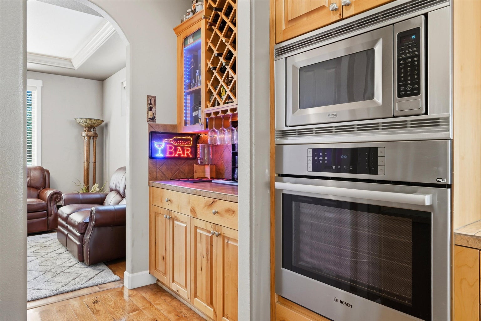 Built in oven close to prep area, pantry, bar space