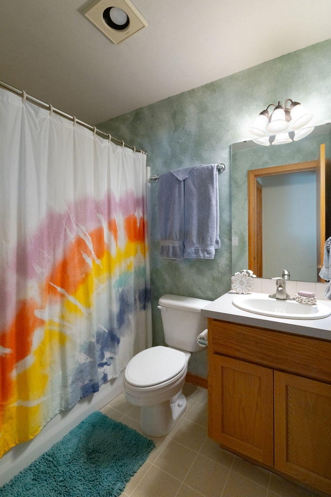 Full bathroom in hallway.