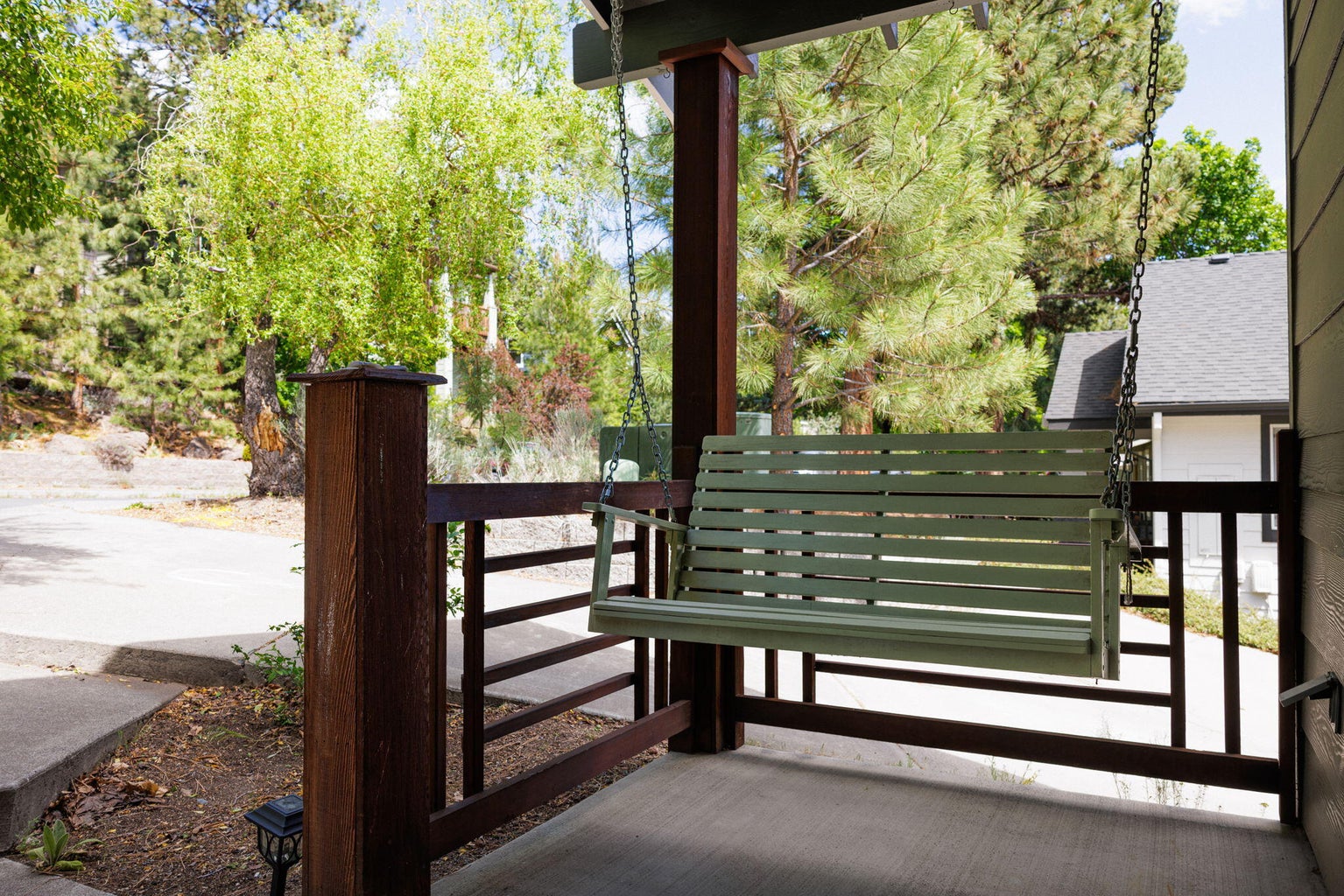 Porch swing for you and your neighbors to visit. Neighbors are very nice!