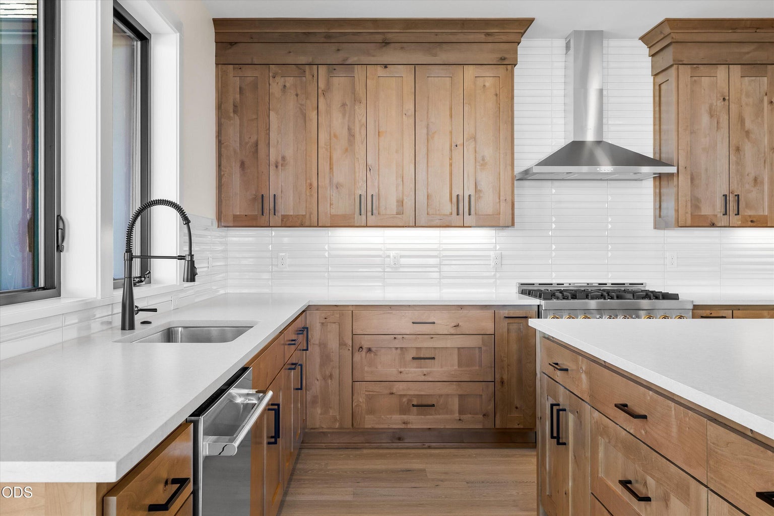 Large windows accommodate amazing views from kitchen sink and workspaces