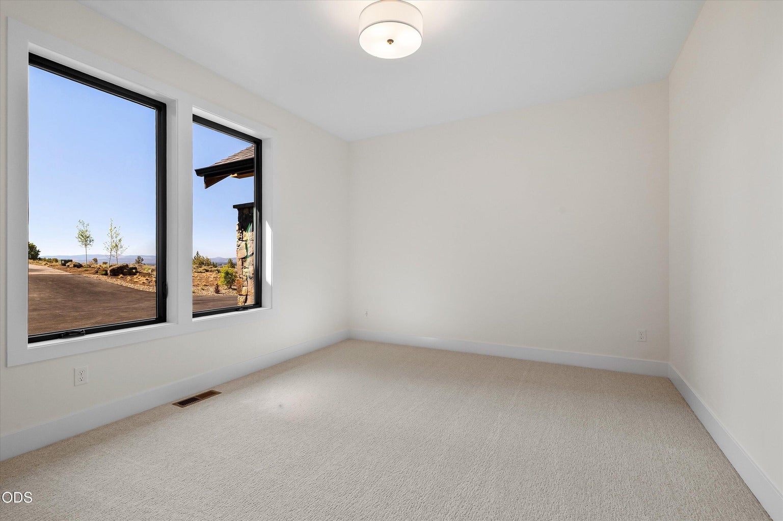 The second primary bedroom off the foyer offers privacy from the other bedrooms