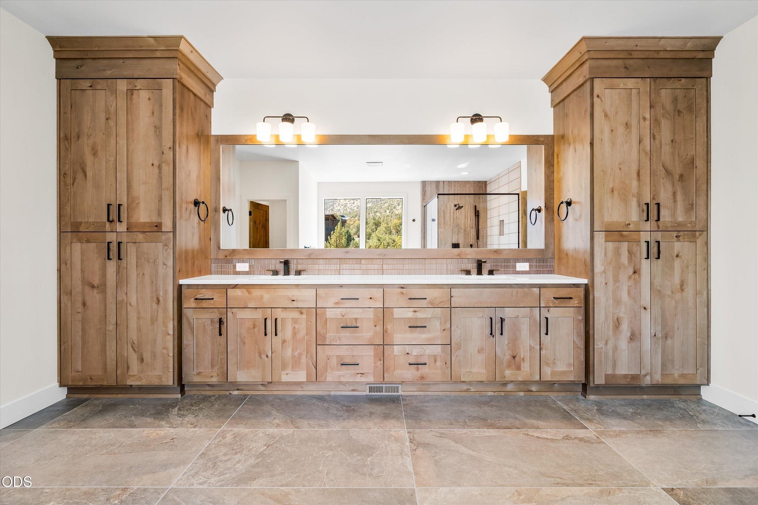 Double vanity with plenty of storage. The water closet and walk-in-closet are to the left.