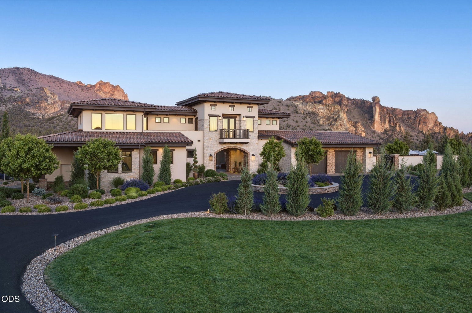 Front of home at dusk, circular drive, Smith Rock backdrop