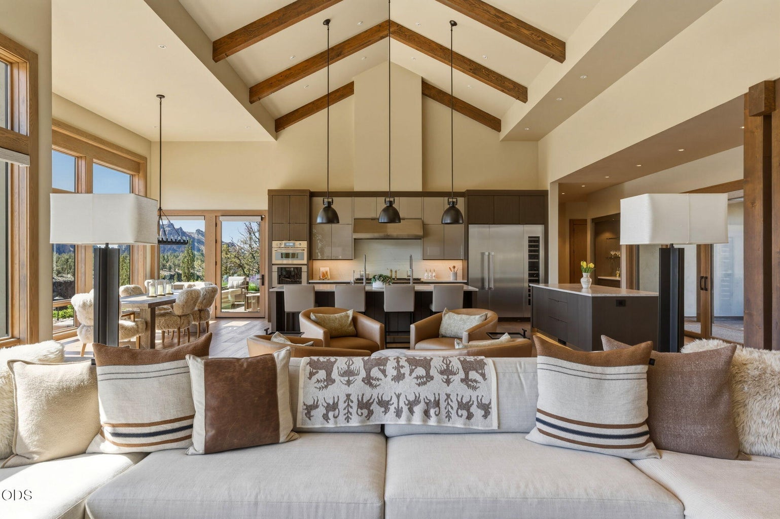 Living room looking toward kitchen, wood beam cathedral ceiling