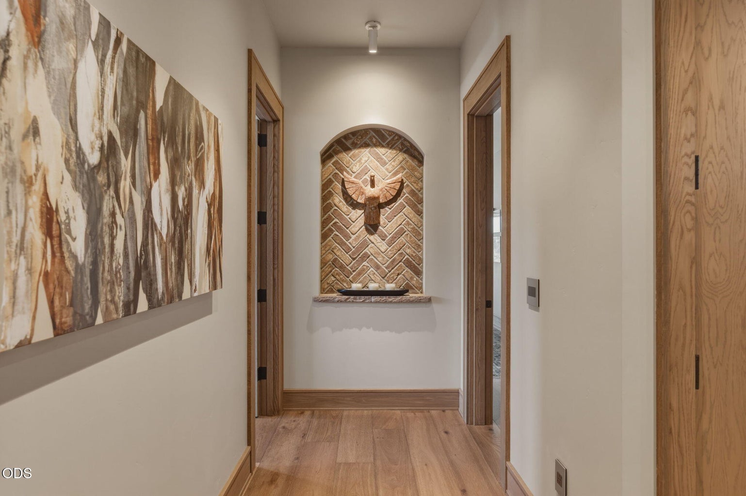 Arched brick niche with sculpture, guest wing beyond