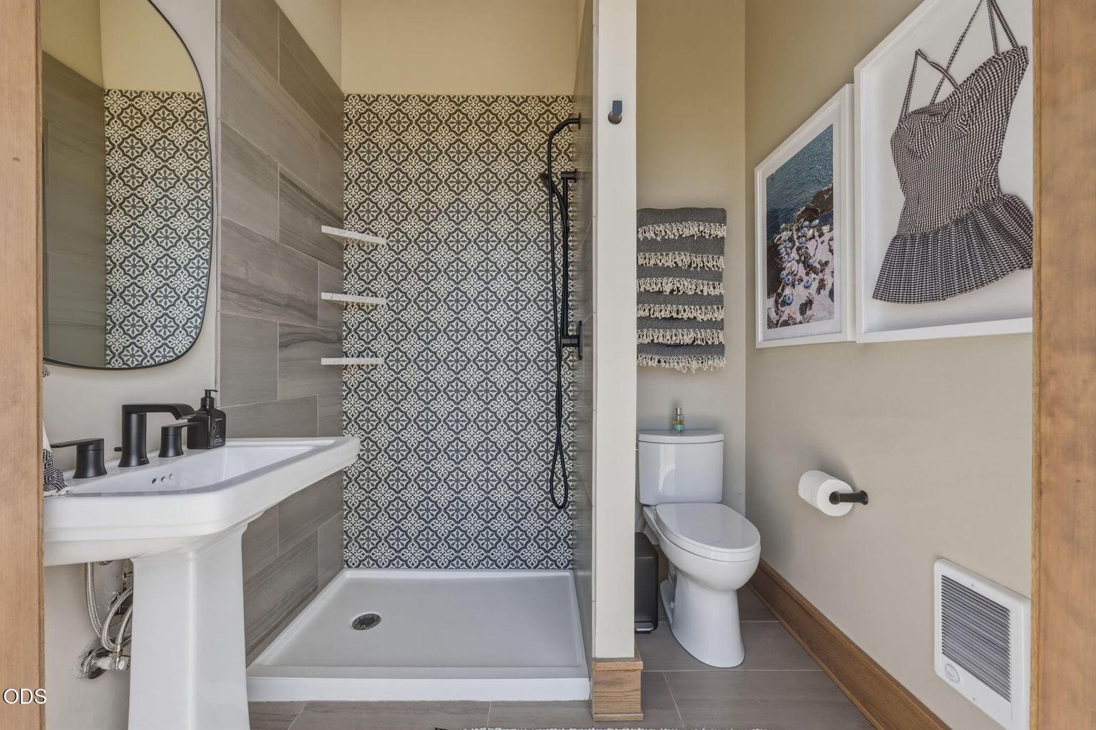 Pool bath/cabana bath, patterned tile shower, pedestal sink
