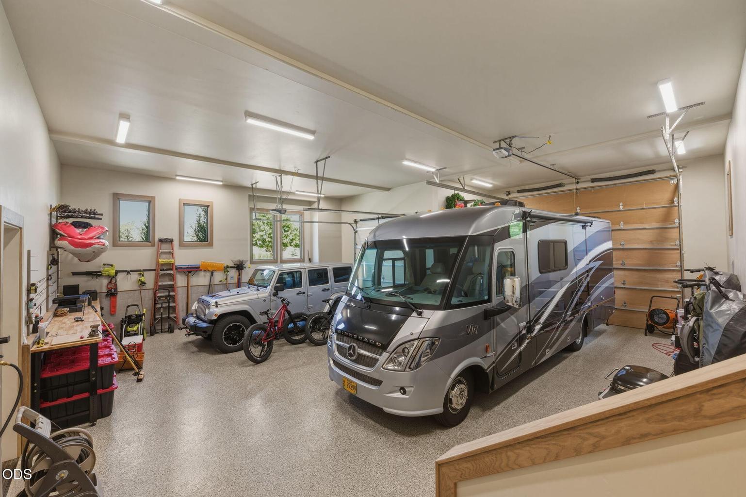 Garage interior, RV bay, Jeep, bikes, full wall tool storage