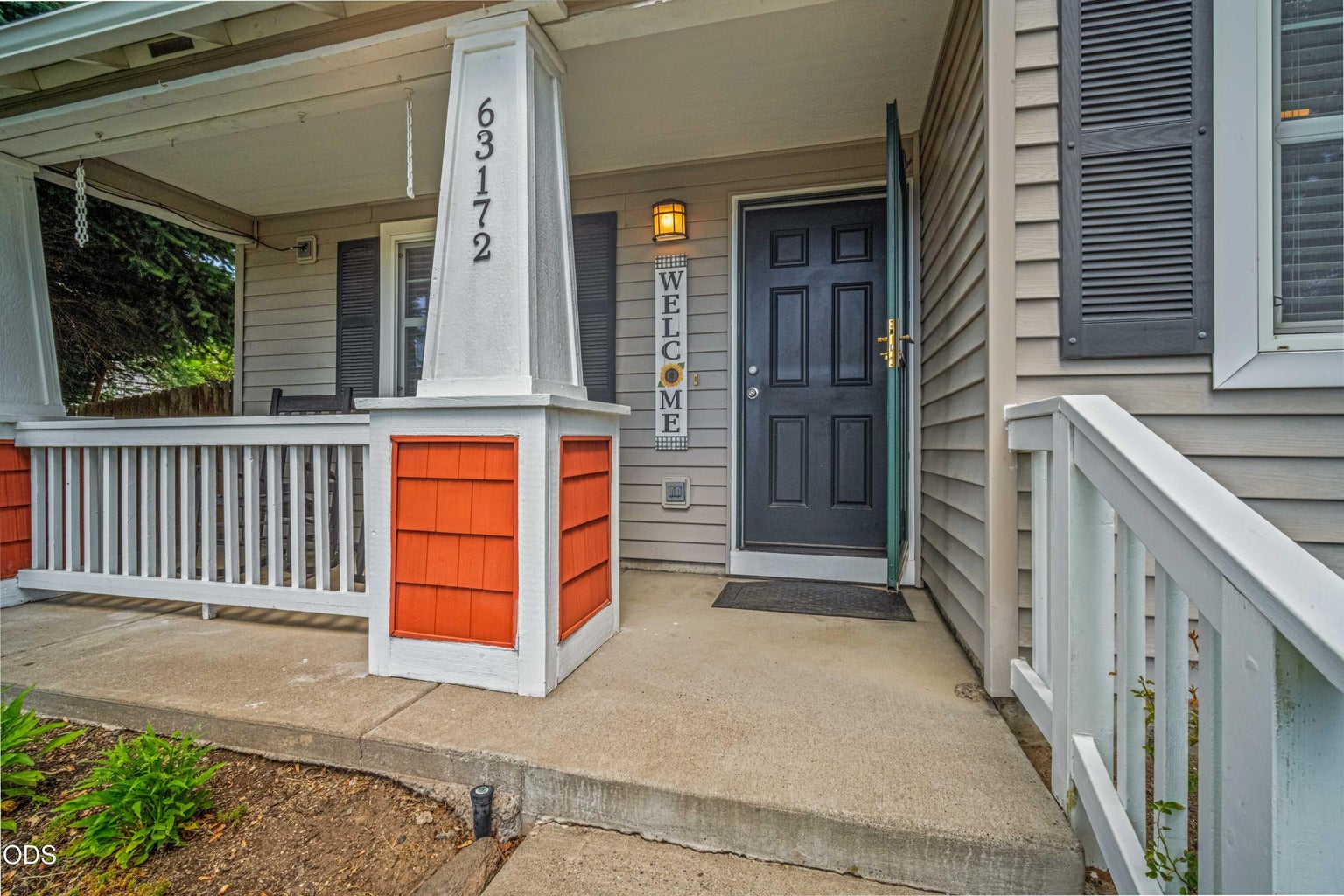 The covered front entry creates a warm arrival point with classic Craftsman-style details and an easy transition into the home.