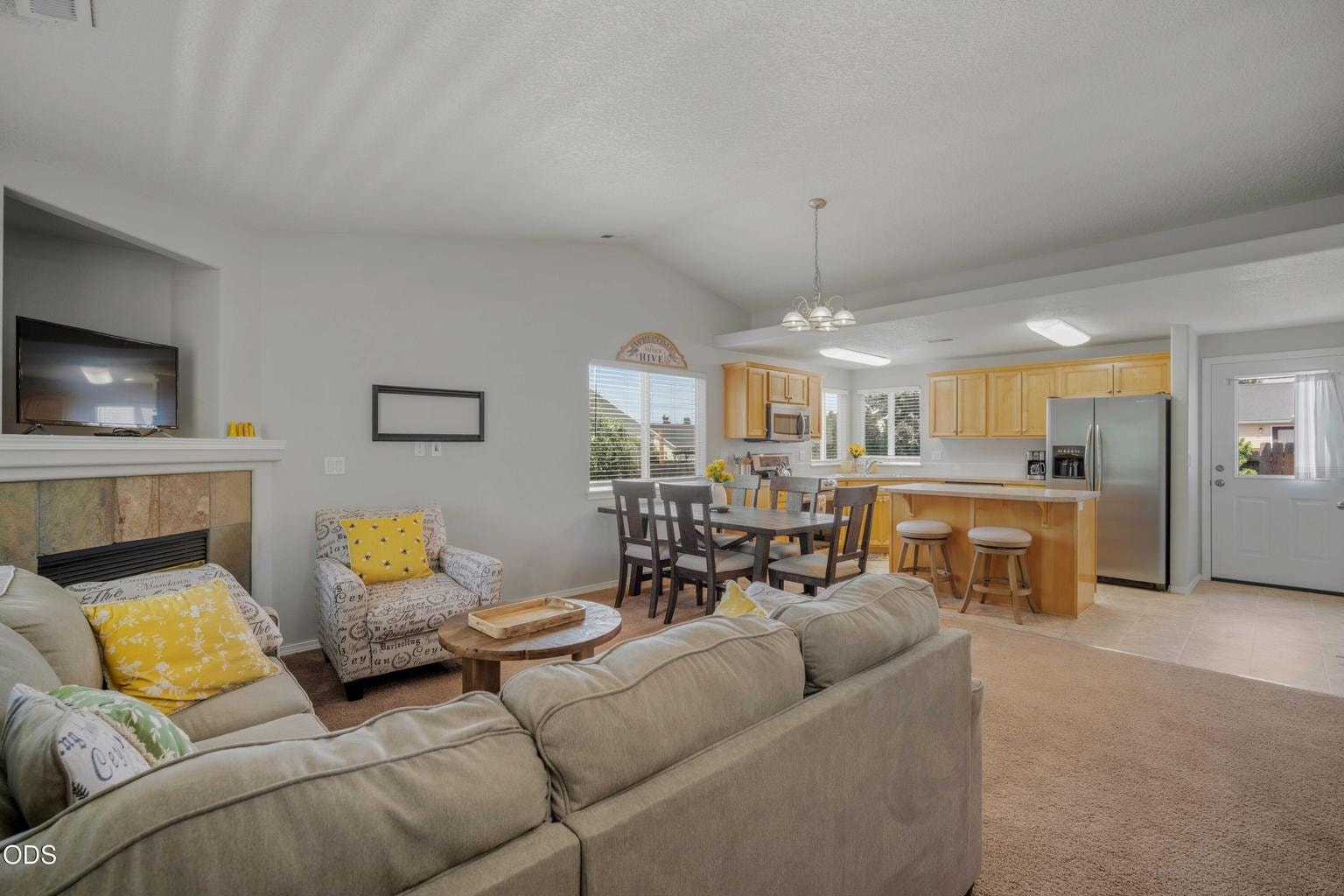 The open-concept great room connects the living, dining, and kitchen areas, creating an easy everyday layout that feels bright, comfortable, and welcoming.