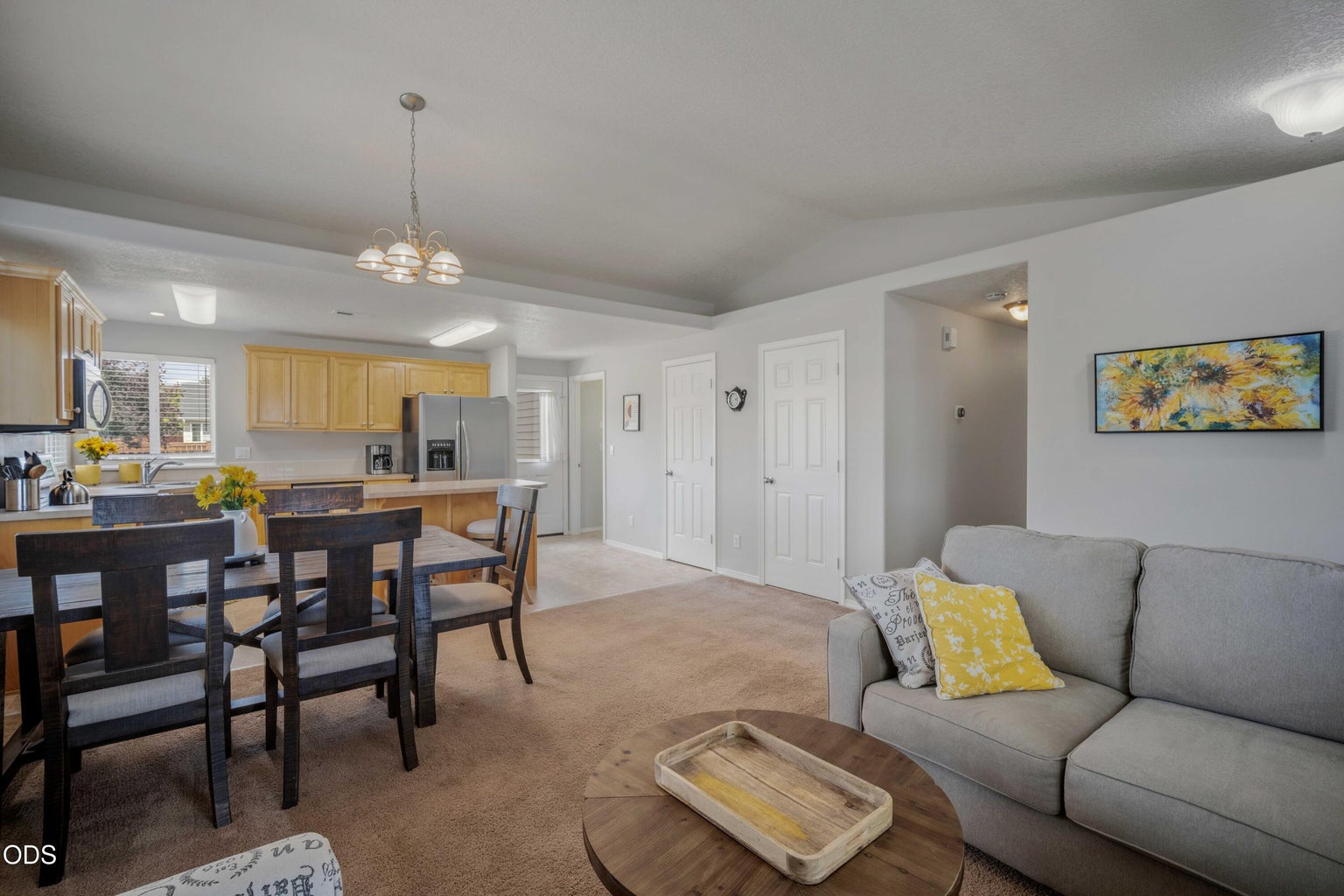 The dining area sits comfortably between the living room and kitchen, making daily meals and casual entertaining easy.