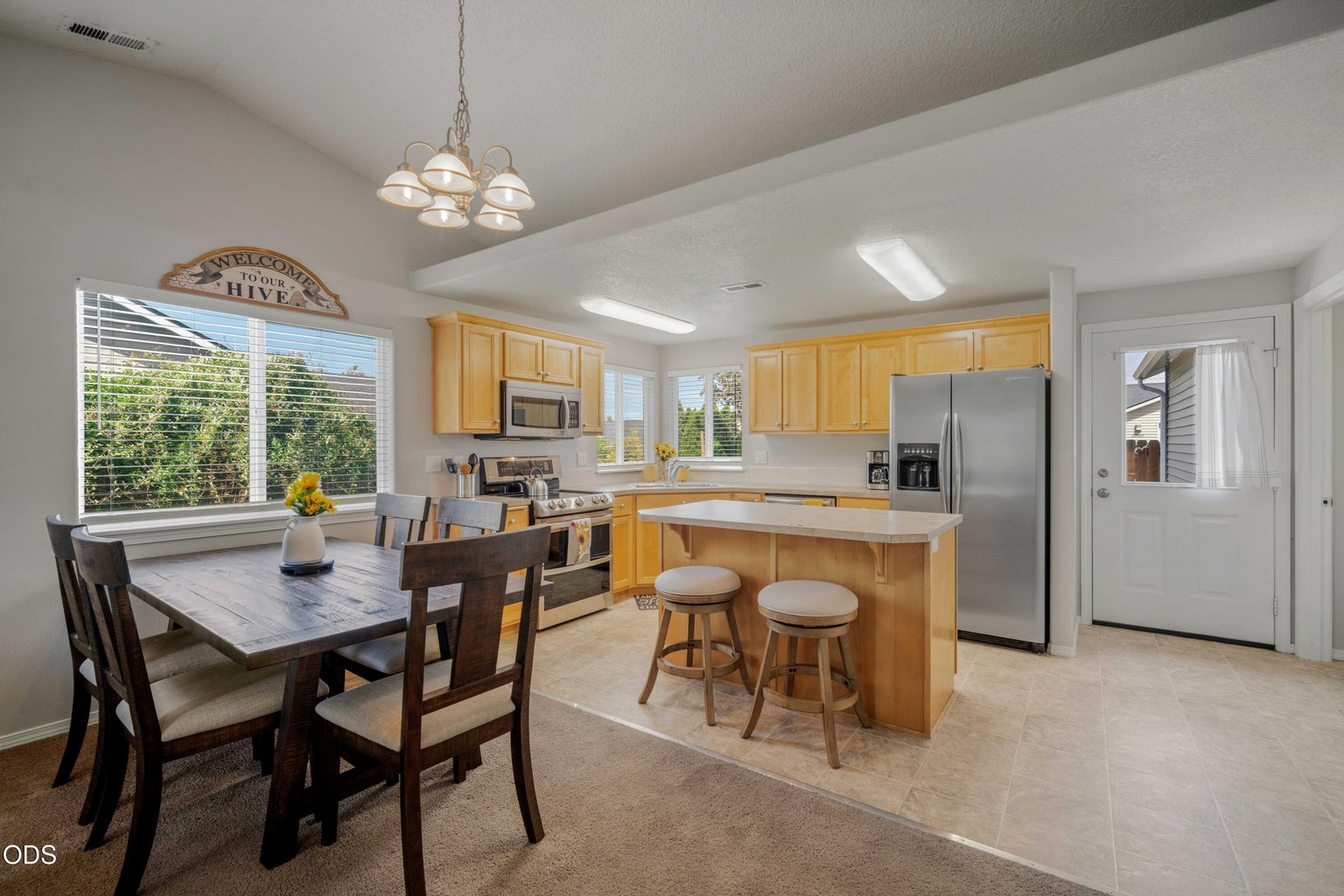 Natural light and open sightlines give the dining and kitchen spaces a connected, inviting feel.