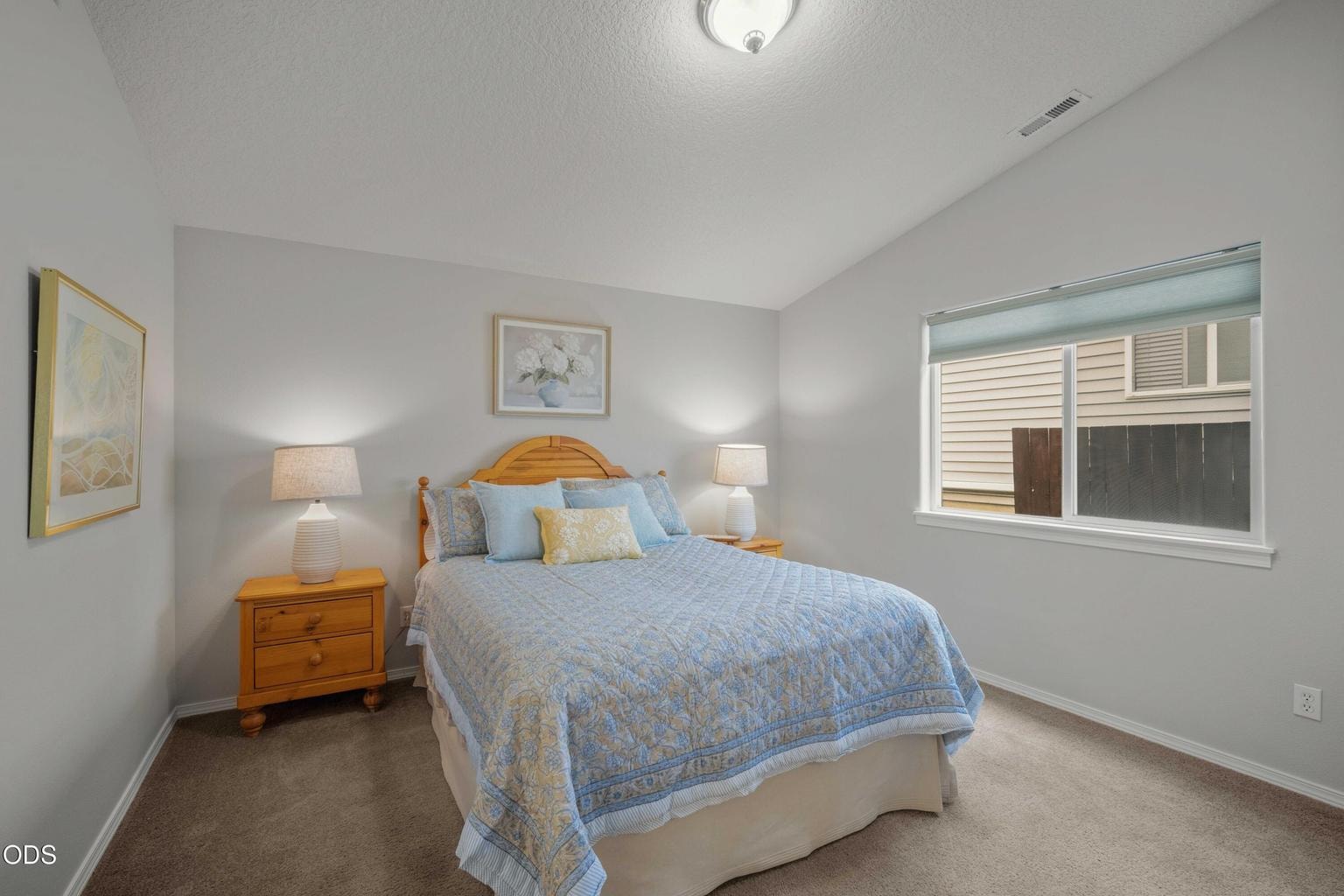 The primary bedroom offers a quiet retreat with soft natural light, comfortable proportions, and a calm, restful feel.