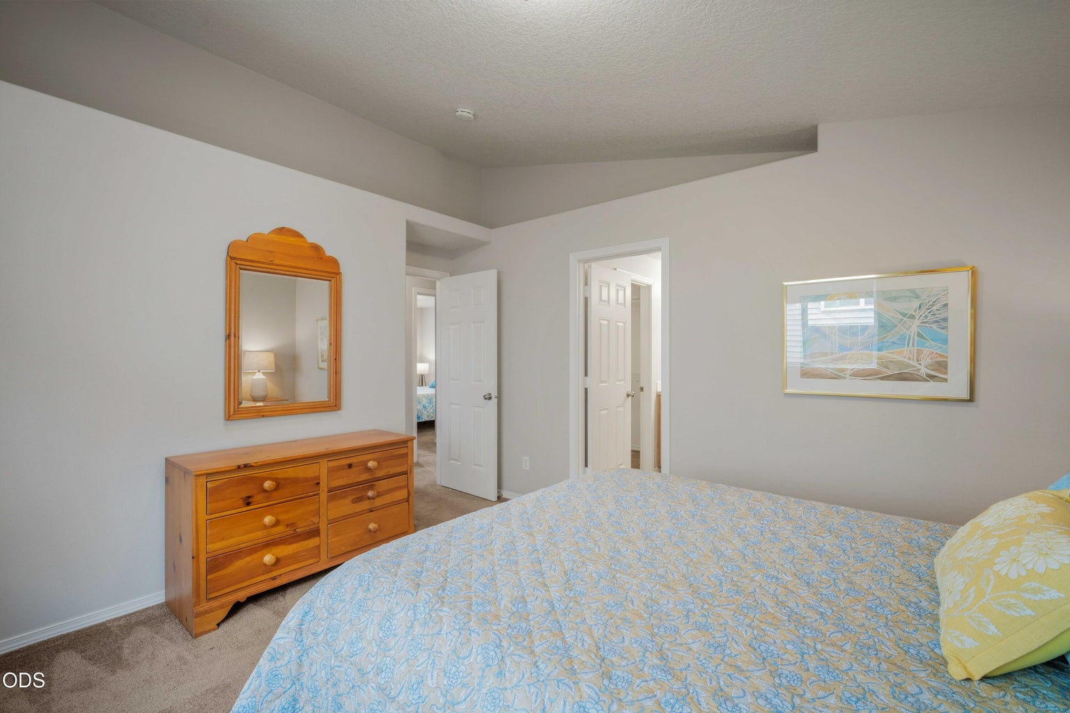 The primary bedroom includes generous wall space and a functional layout that is easy to furnish.