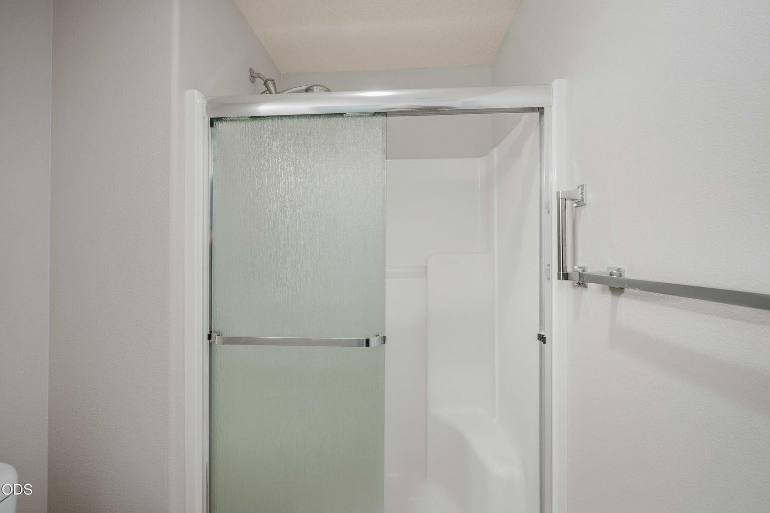 A step-in shower adds comfort and function to the private primary bath.