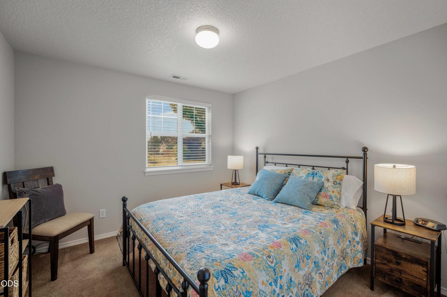 This bright secondary bedroom offers flexibility for guests, family, work-from-home use, or hobbies.