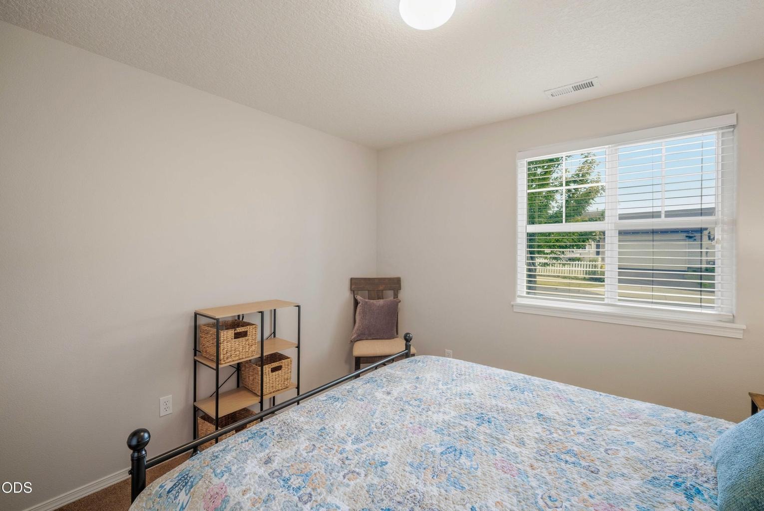 Natural light and a clean, versatile layout make this bedroom easy to adapt to changing needs.