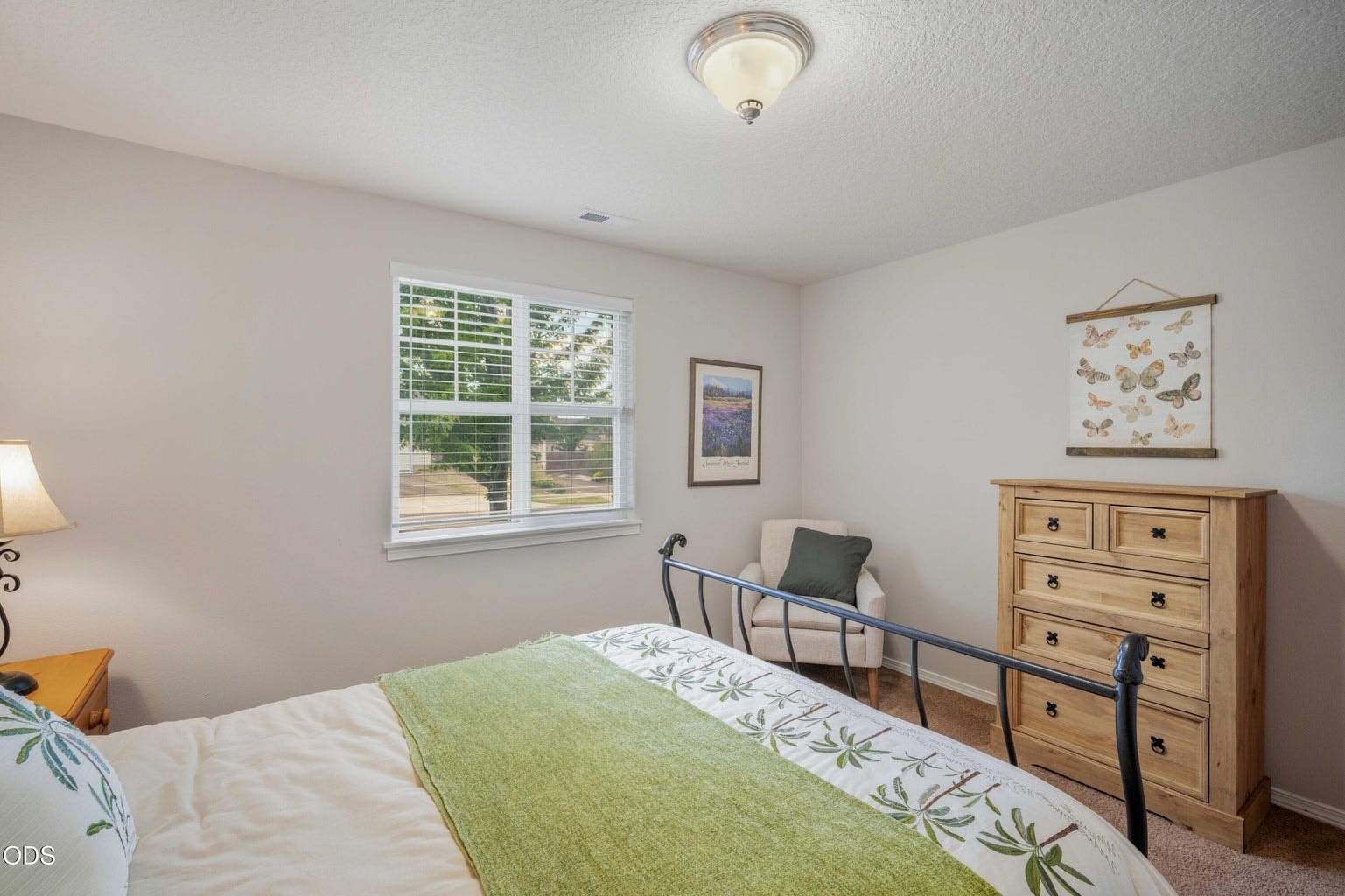 This bedroom offers a flexible layout with room for sleeping, reading, study, or additional storage.