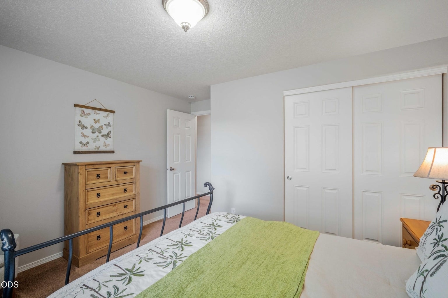 A closet and simple, usable layout make this bedroom a practical part of the home’s three-bedroom design.