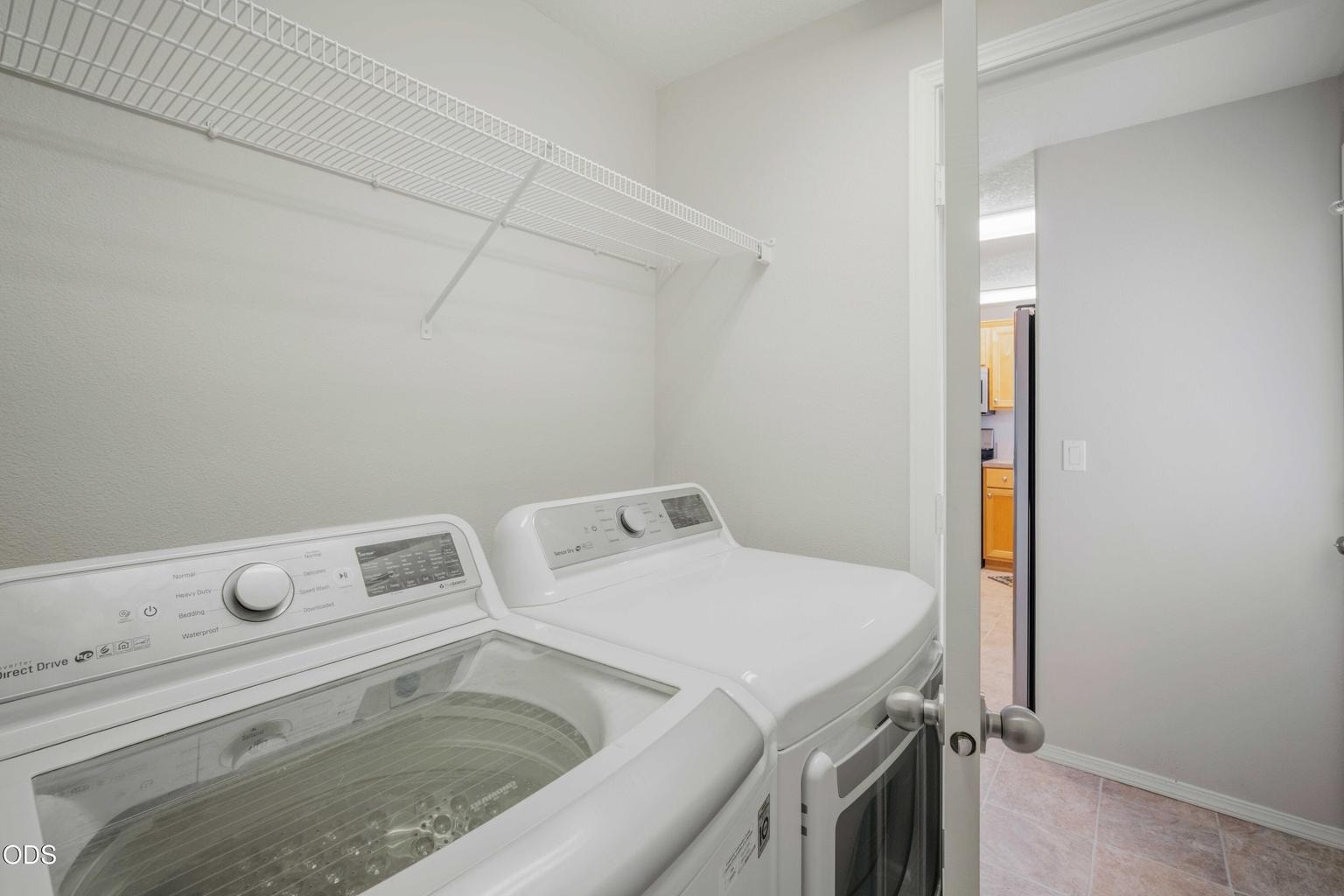 A dedicated laundry room adds everyday convenience and useful separation from the main living spaces.