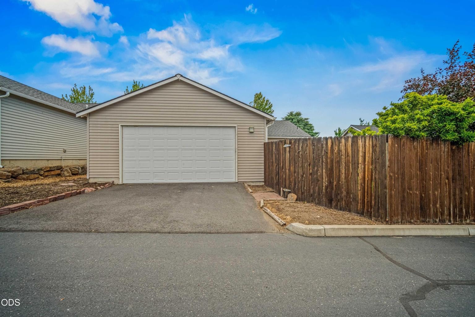 Alley access leads to the two-car garage, adding convenient parking and storage while preserving the home’s charming front streetscape.