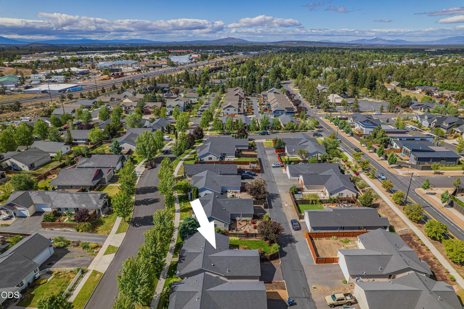 This aerial view places the home within Bend’s Empire Crossing neighborhood, close to community green space and everyday conveniences.