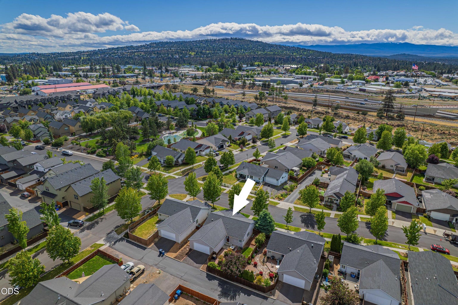 This elevated view shows the home’s proximity to neighborhood park space and the broader convenience of the Empire Crossing setting.