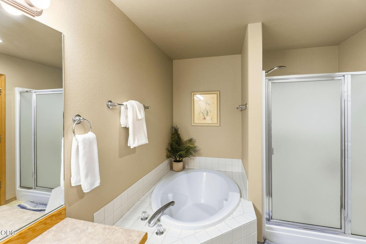 Second primary bath with walk in shower and large soaking tub