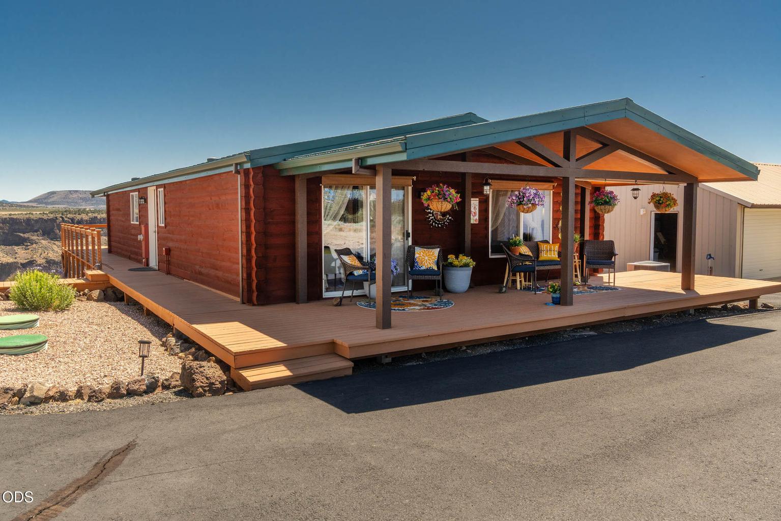 Lovely covered deck is westerly facing, and wraps around three sides of home.
