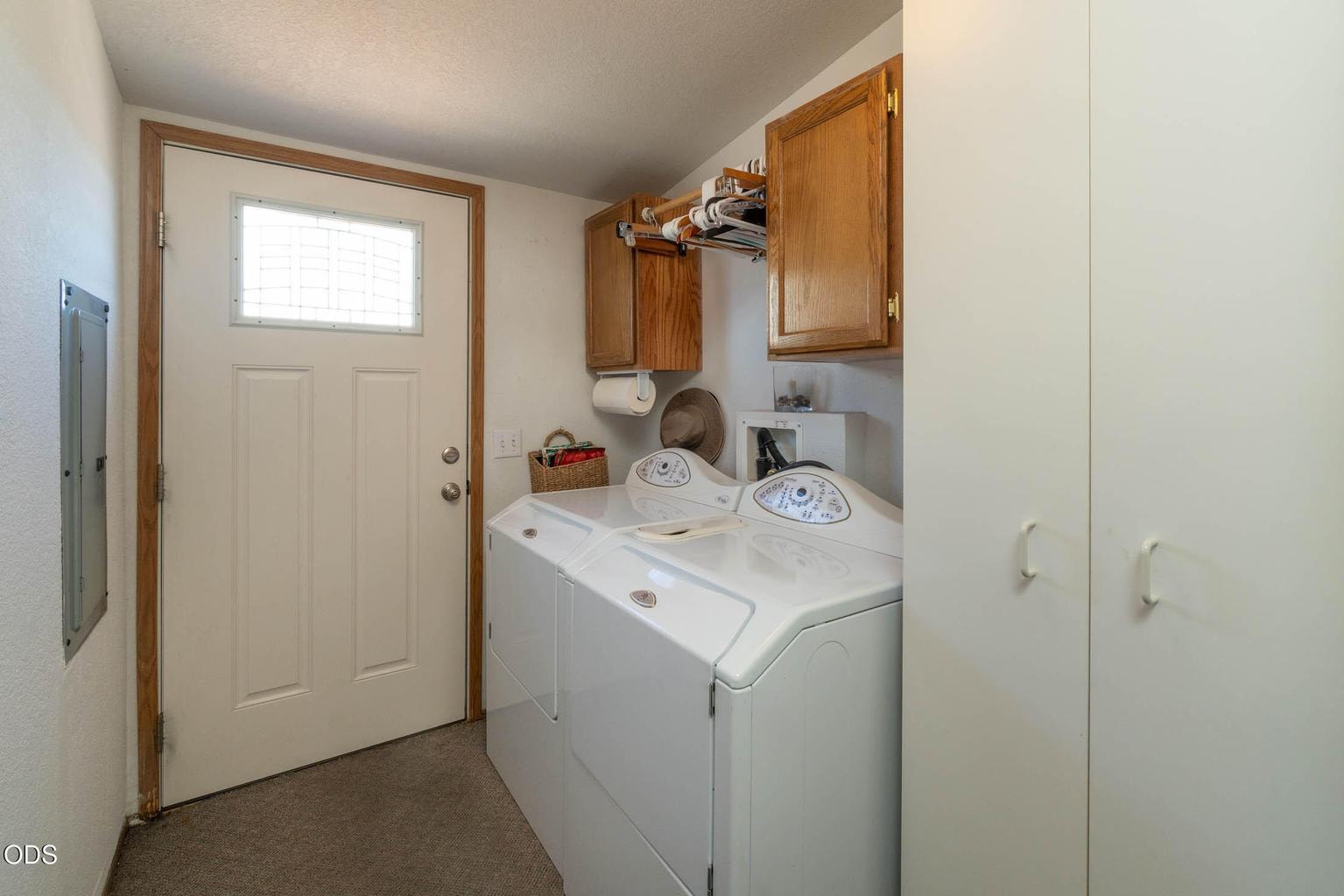 Maytag W/D included. Laundry has exterior access, cabinetry and bar for hanging laundry.
