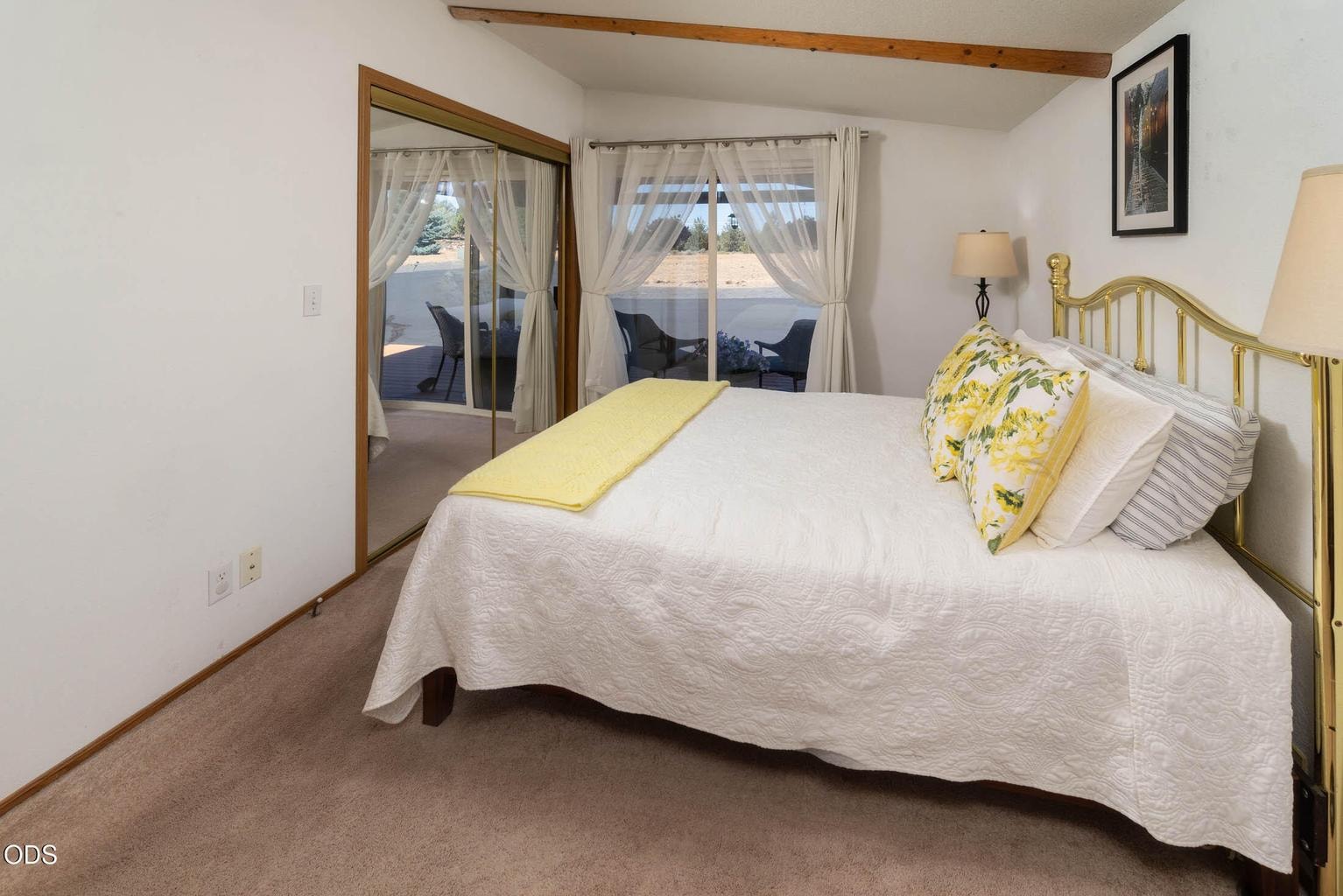 Primary bedroom en-suite with access to covered deck.