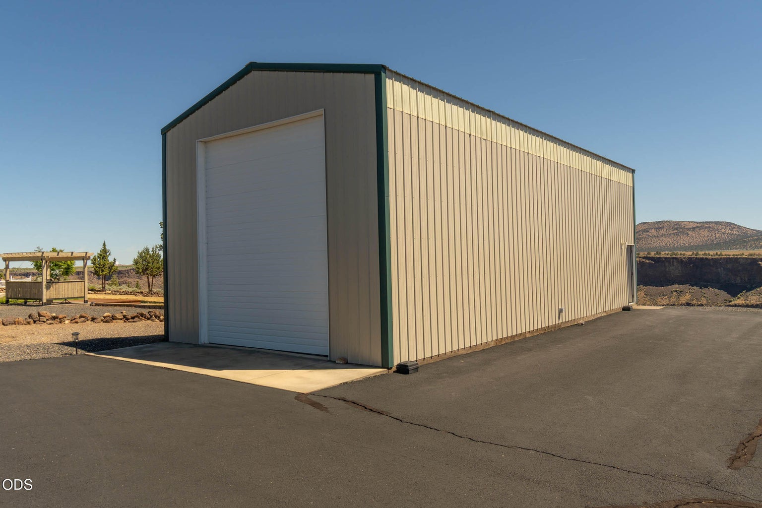 RV storage building is 48' X 20', with concrete floors and concrete apron and man-door.