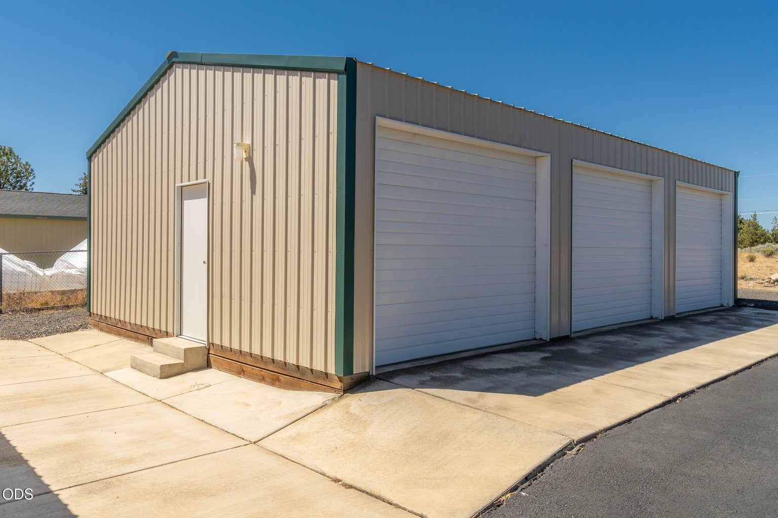 Three-car garage, with ample room for storage, @ 864 square feet, with 3 overhead doors, 2 door openers, concrete floors and man door.