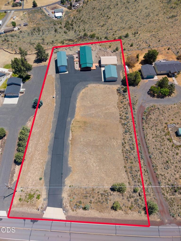 Low maintenance property, with asphalt drive and turnouts, on paved road.