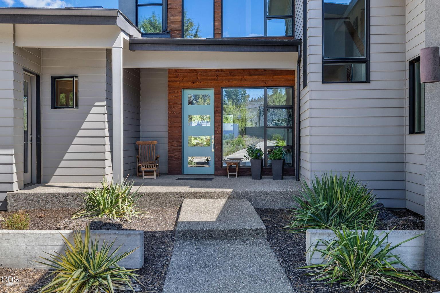 The contemporary hardscape sets the tone for the home.