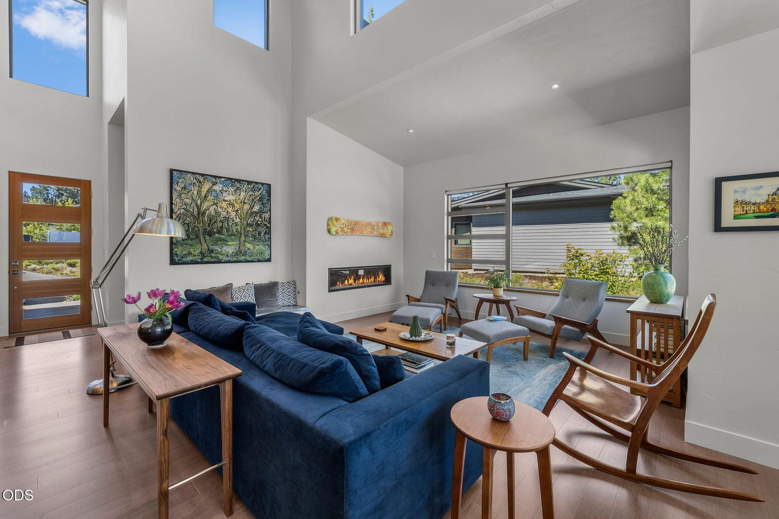 Vaulted ceilings and abundant windows create a bright, welcoming ambiance.