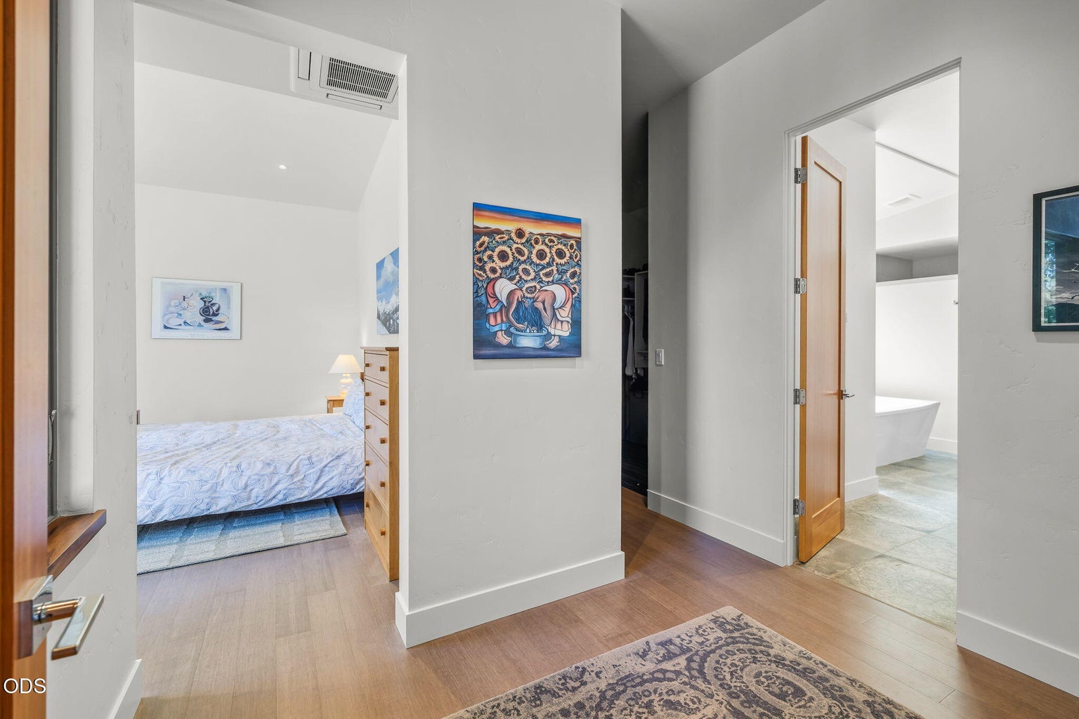 Privately positioned in a separate wing, the primary suite features a large walk-in closet and luxury bath