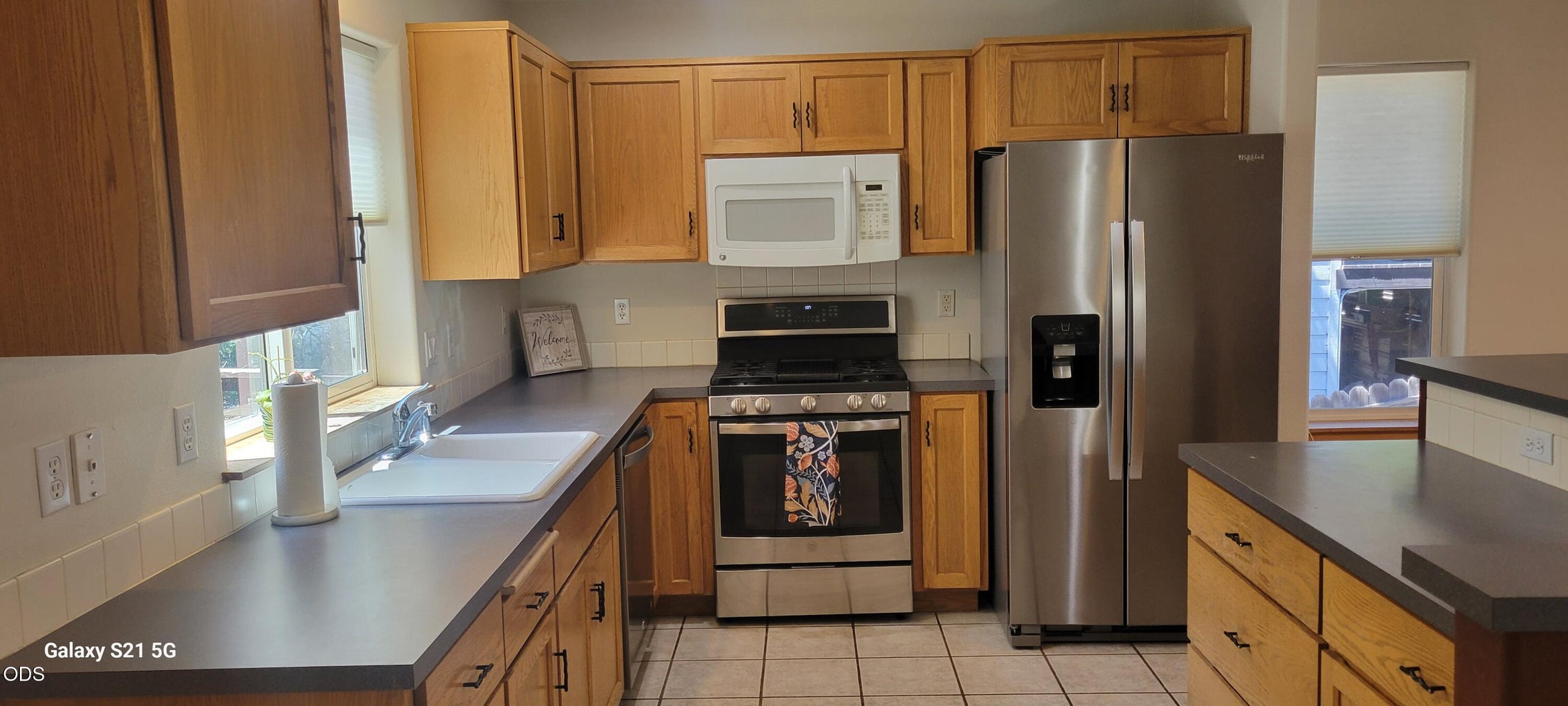 Lots of cabinets and stainless steel appliances!
