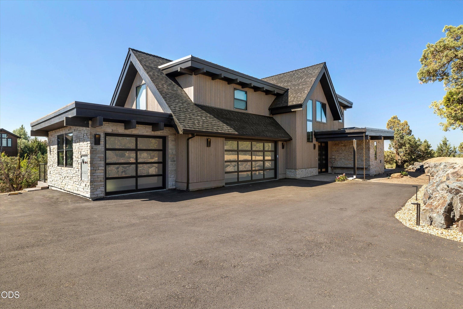 Drive up to a 3-car attached garage to this mountain modern home