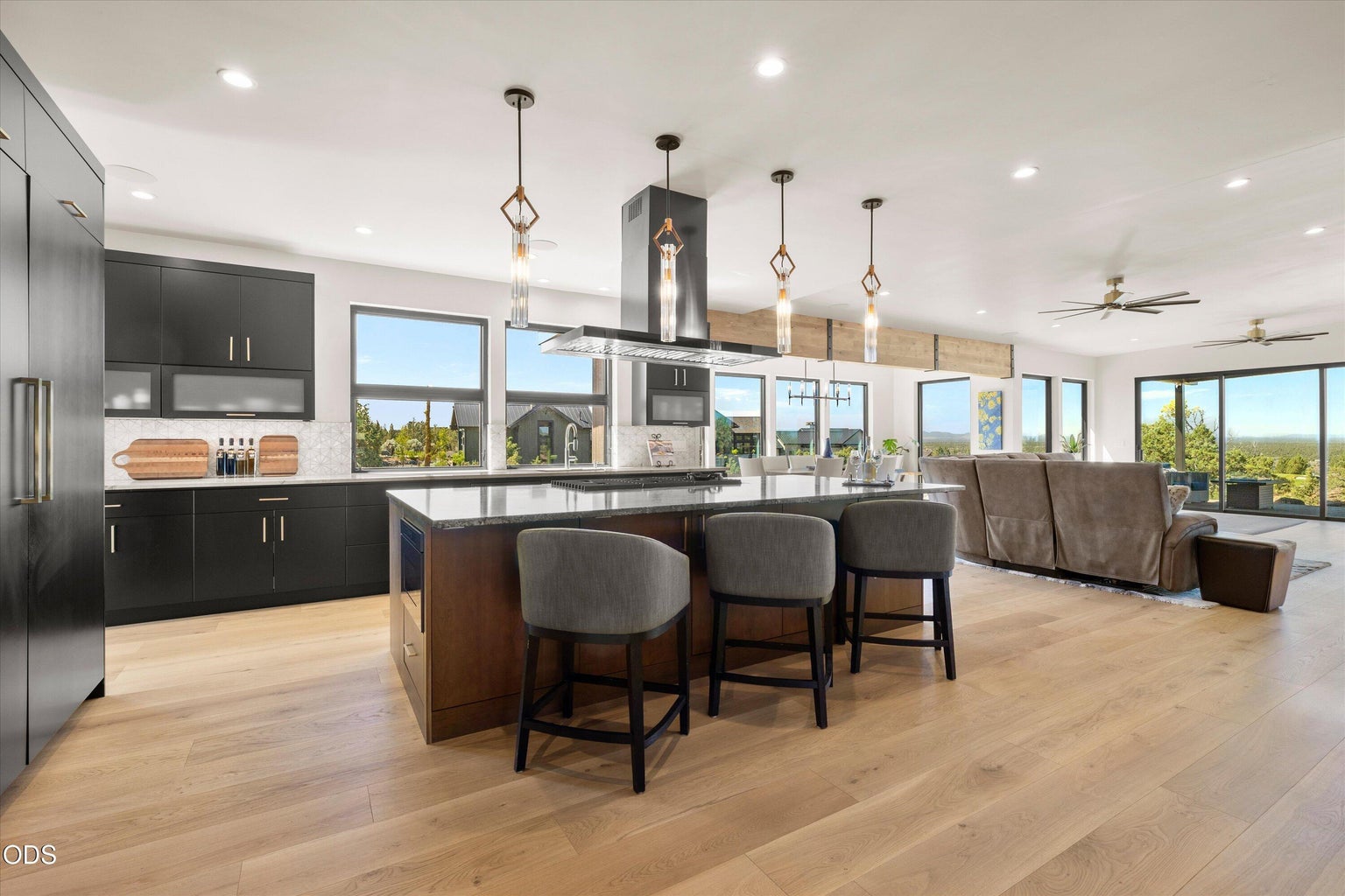 Dark modern accents frame the bright and airy great room